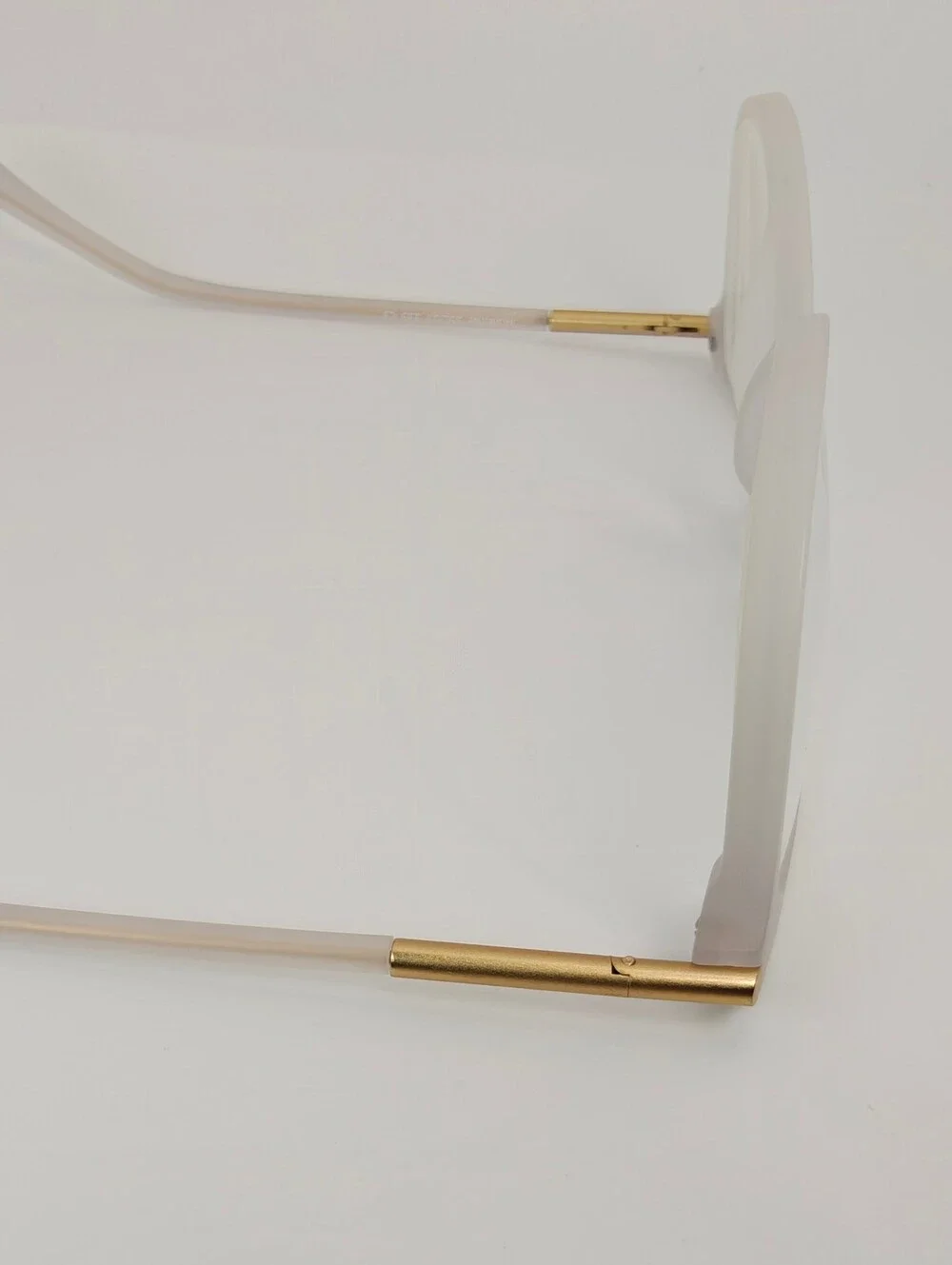 Cylinder. Women's Frosted White Round Frame Glasses. Cylinder Gold Highlights.